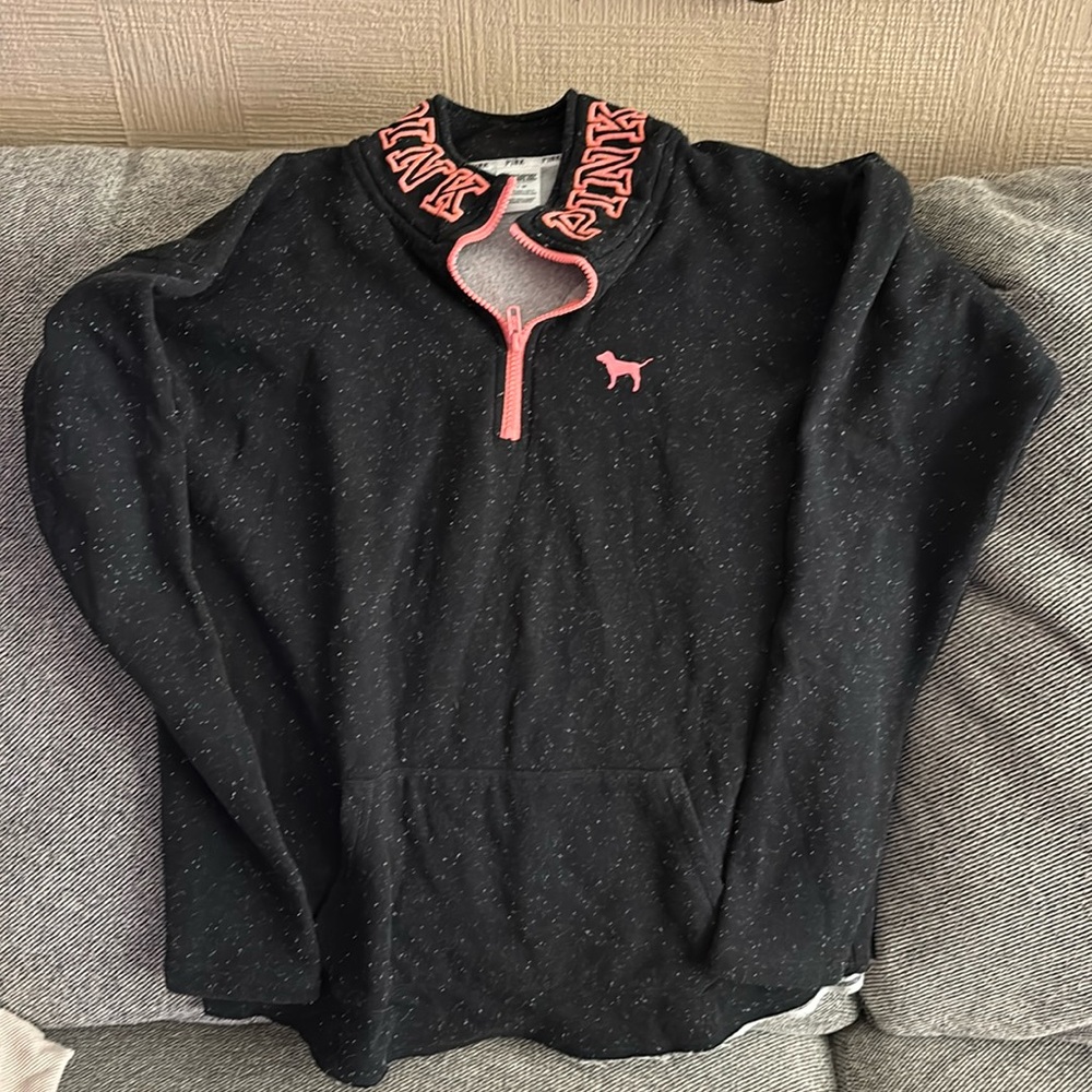 Women’s size medium pink brand pullover. Black with specs and pink letters.